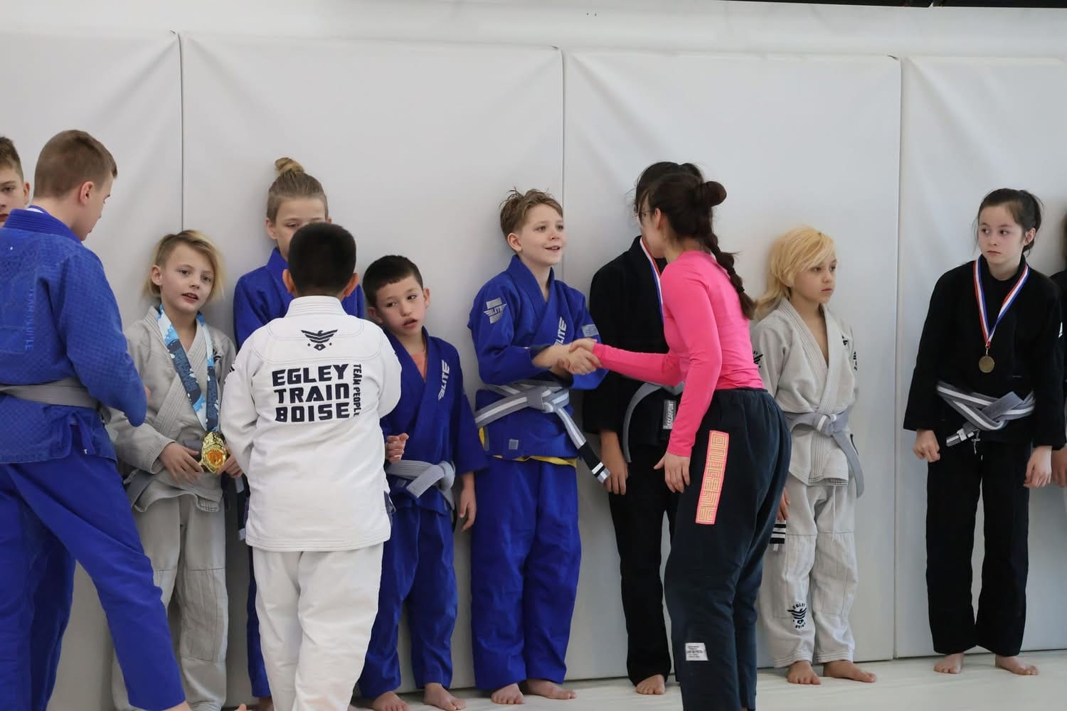 Kids Brazilian Jiu-Jitsu offers both physical and mental health benefits through a well-structured class where BJJ practitioners train with partners, learn new techniques, and develop strength, discipline, and confidence.